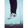 copy of Person Wearing Pair of White Adidas Superstar Shoes